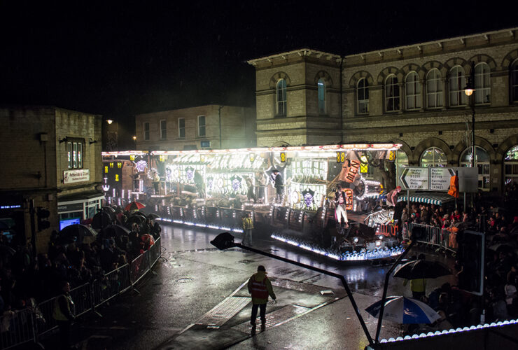 A carnival float at night outside Midsomer Norton town hall
